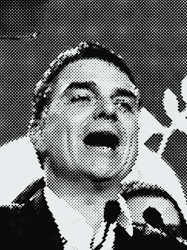 Flávio Bolsonaro em vídeo do canal dele (26/07/2026), em retícula, com tarja vermelha nos olhos e rabiscos em volta da cabeça.
